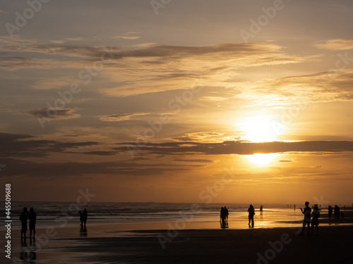 Sunset, Silhouette of people in Parangtritis Beach, Bantul, Yogyakarta Indonesia 