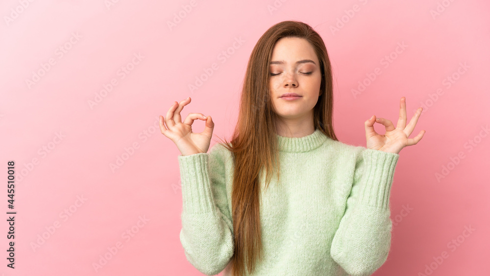 Teenager girl over isolated pink background in zen pose Teenager girl over isolated pink background in zen pose