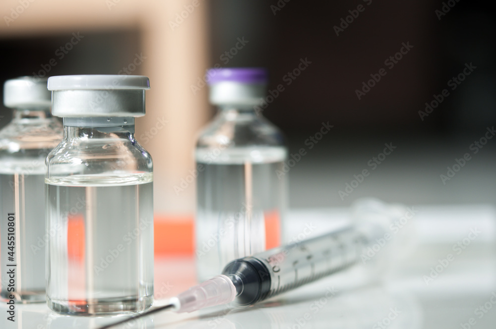 Selective Focus of Syringe and Medicine in vial , ready for vaccine injection , Cancer Treatment , Pain Treatment and can also be abused for an illegal use, healthcare and medical concept vaccination. Selective Focus of Syringe and Medicine in vial , ready for vaccine injection , Cancer Treatment , Pain Treatment and can also be abused for an illegal use, healthcare and medical concept vaccination.