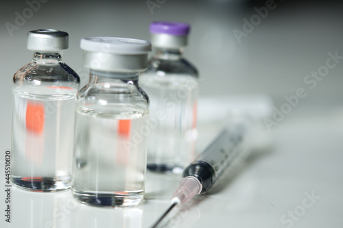 Selective Focus of Syringe and Medicine in vial , ready for vaccine injection , Cancer Treatment , Pain Treatment and can also be abused for an illegal use, healthcare and medical concept vaccination.