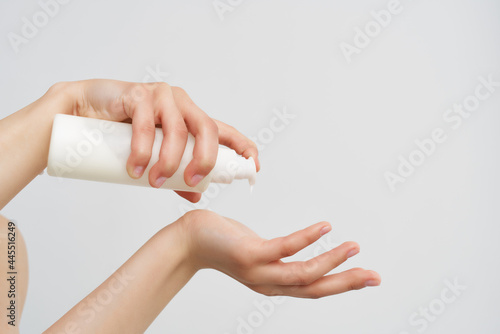lotion in woman hands clean skin moisturizing close-up