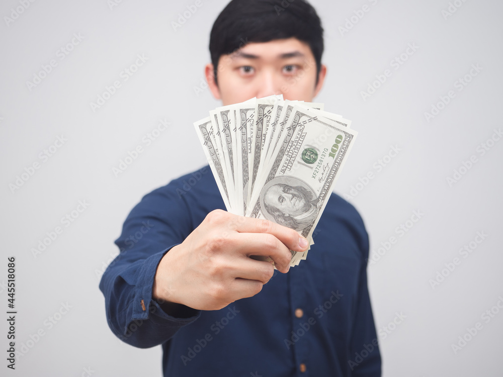 Closeup money in man hand on white background,Businessman show money in hand get salary concept Closeup money in man hand on white background,Businessman show money in hand get salary concept