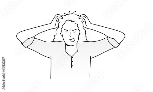 Angry young woman holding her head with her hands.