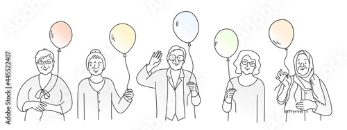 Group of elderly women with balloons greet.