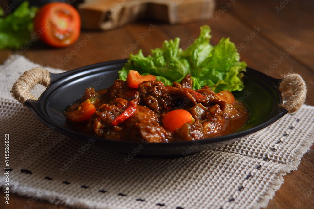a plate of chicken meat cooked in spicy a plate of chicken meat cooked in spicy