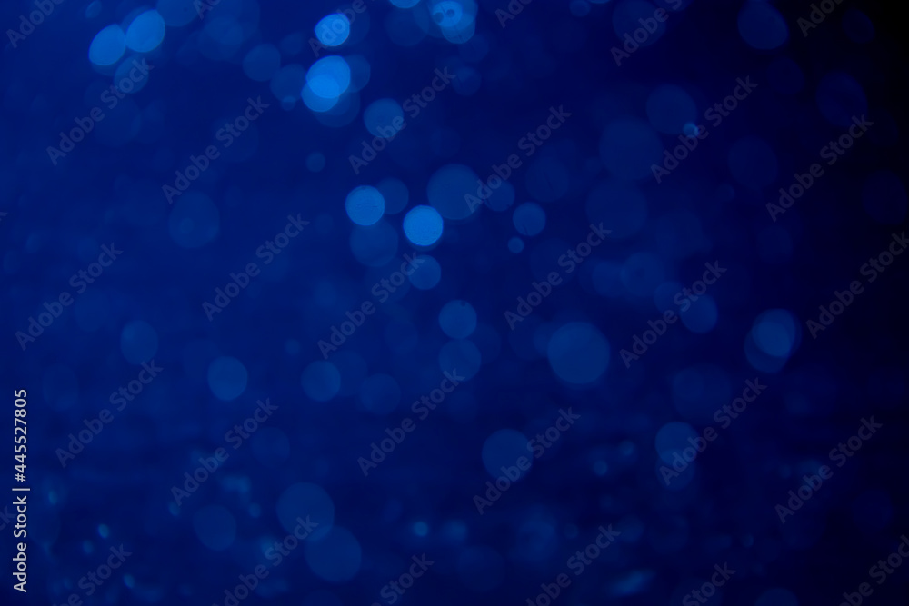 Abstract blue bokeh with black background
