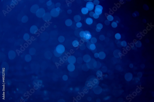 Abstract blue bokeh with black background