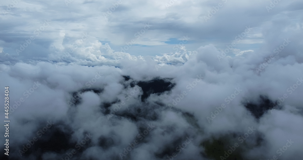 Aerial view white clouds. View from drone. Aerial view cloudscape. View from above. Sunrise or sunset over clouds.