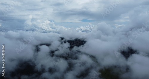 Aerial view white clouds. View from drone. Aerial view cloudscape. View from above. Sunrise or sunset over clouds.
