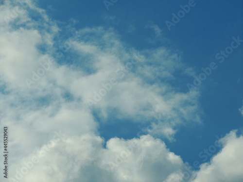 Blue sky with clouds over Russia. Summer skies. Russian sky with clouds. Gray-white and blue colors. Eco Sky in 2021. A sunny day. © Александр Калинин