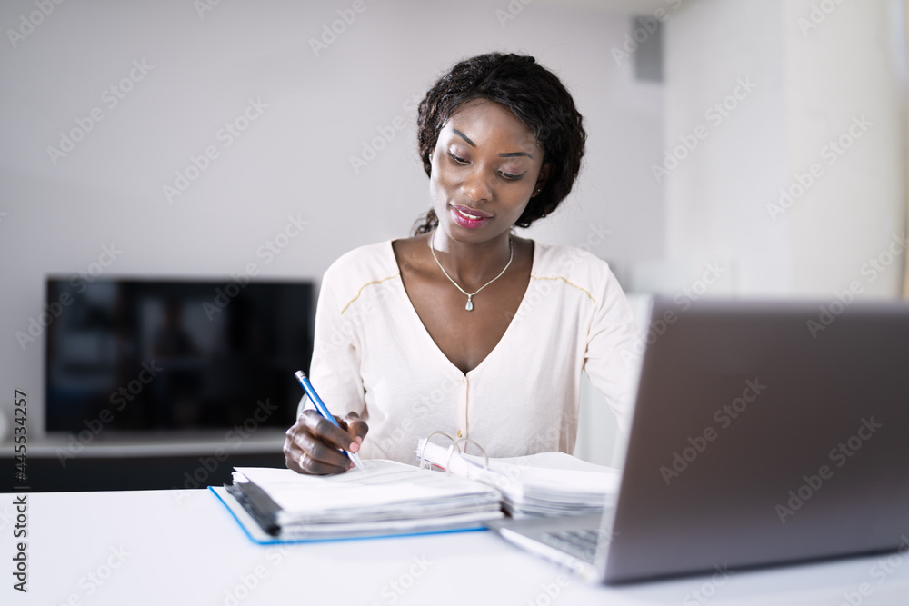 Happy Young African Woman Doing Taxes Happy Young African Woman Doing Taxes