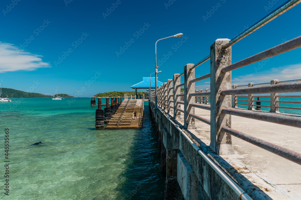 Concrete pier in shells in the middle of the sea in sunny weather