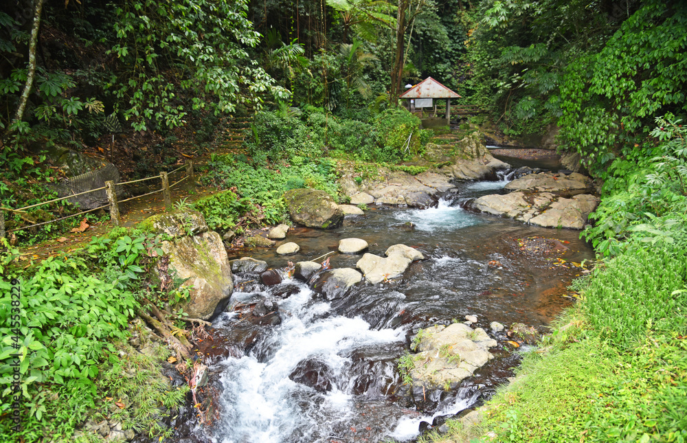 River at gitgit waterfall with alot of stones and smooth clear water River at gitgit waterfall with alot of stones and smooth clear water