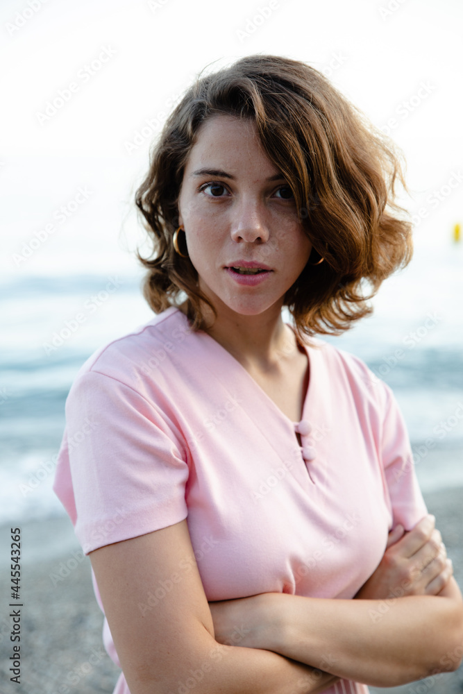 Natural beauty of as young lady in her vacation time enjoying her holidays in a beach of the coast side in a tourist location. breathing with a freedom feeling a pink vintage dress Natural beauty of as young lady in her vacation time enjoying her holidays in a beach of the coast side in a tourist location. breathing with a freedom feeling a pink vintage dress