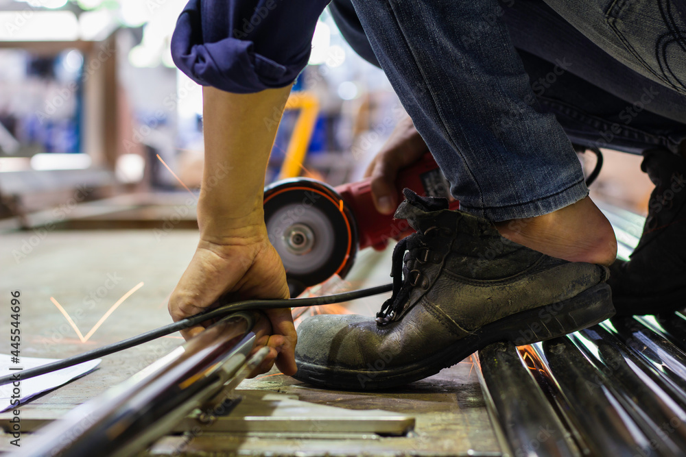 without safety gloves at work. Construction workers do not wear gloves and  safety shoes to work. Workplace is not safe. focus on shoes Stock Photo |  Adobe Stock