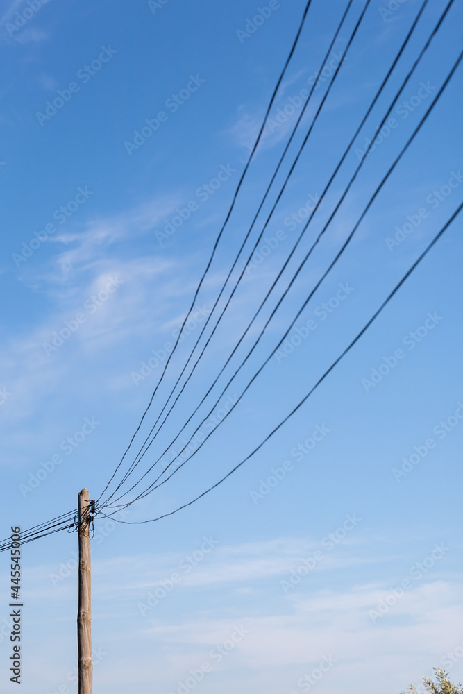 Looking up at telegraph pole with many wires Looking up at telegraph pole with many wires