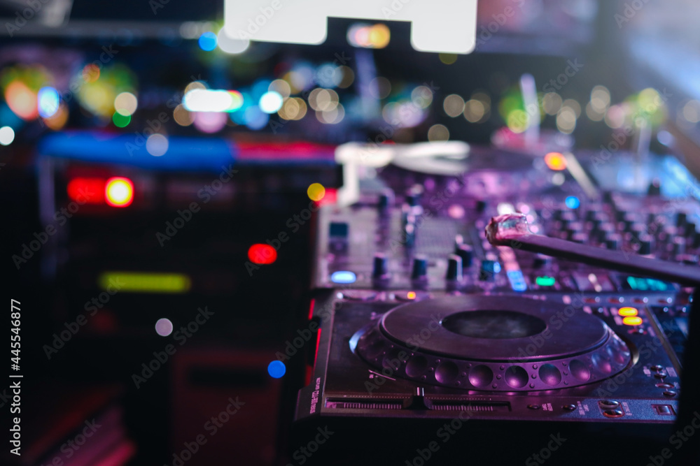 DJ controller turntable console mixing desk at stage in the night club, music beach party festiva and nightlife