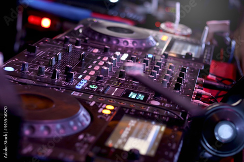 DJ controller turntable console mixing desk at stage in the night club, music beach party festiva and nightlife