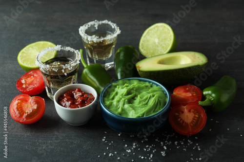 Party concept with tequila, guacamole and chips