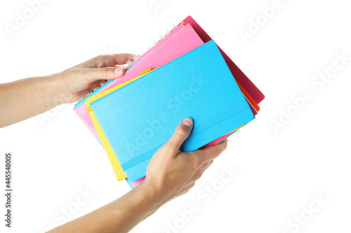 Female hands hold copybooks, isolated on white background