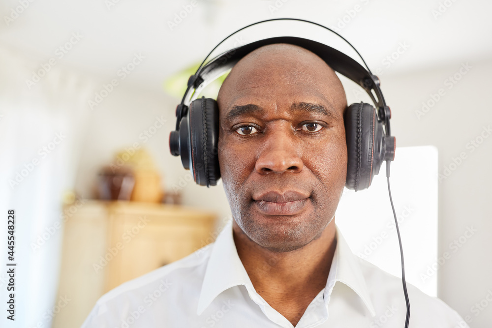 Man with headphones video chat or listening to music Stock Photo