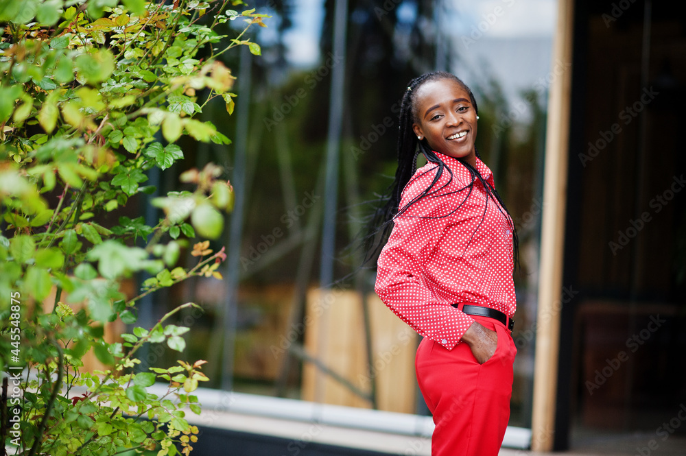 Pretty braids business african american lady bright bossy person friendly wear office red shirt and trousers. Pretty braids business african american lady bright bossy person friendly wear office red shirt and trousers.
