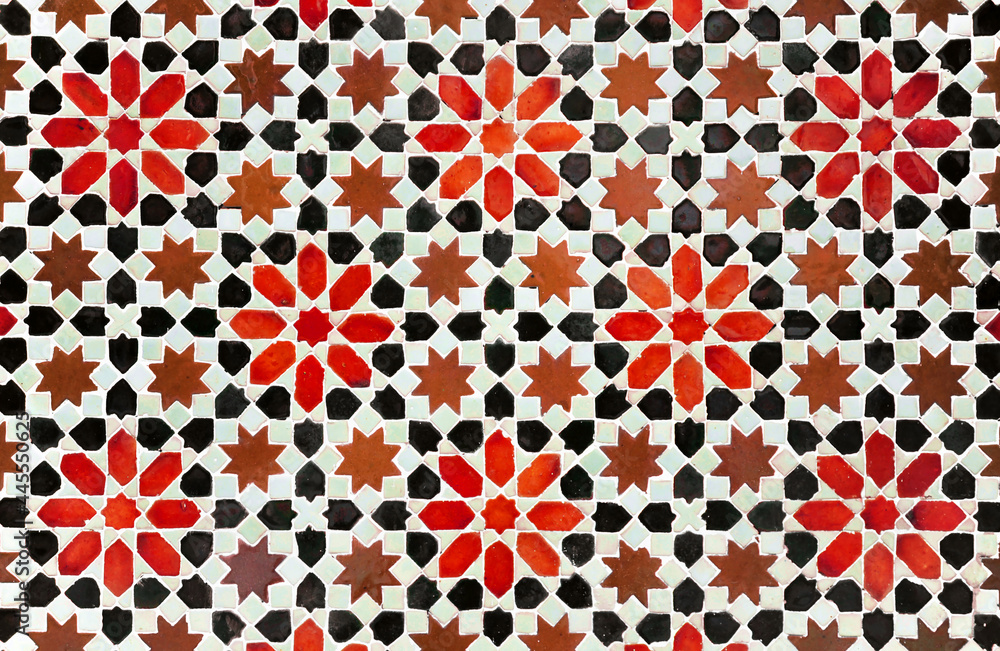 Obraz premium Decorative background in arabic mosaic style. Morocco style star tiles. Composition of star tiles in red, brown and black color on a white background.