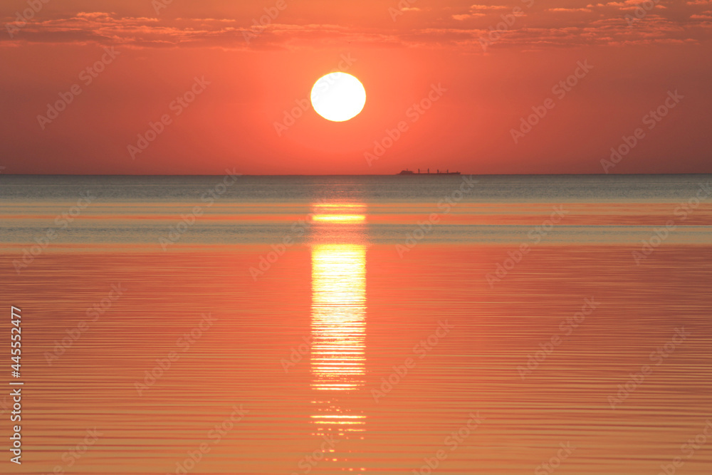 Evening sun over the tropical sea with waves. Nature background