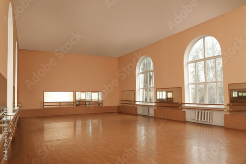 View of empty studio with mirrors and ballet barres