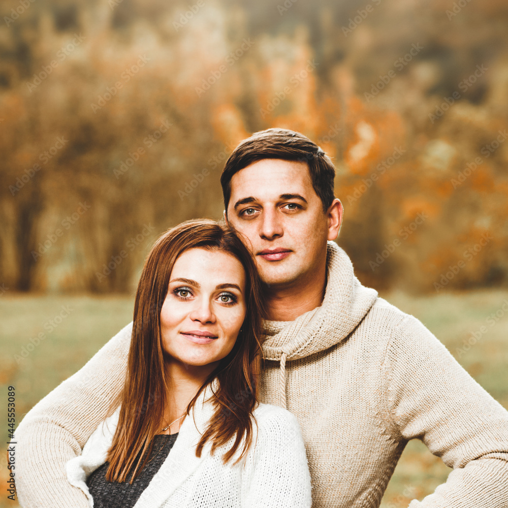 Portrait of young romantic couple in love having date in autumn park Portrait of young romantic couple in love having date in autumn park