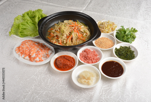 diy Traditional popiah spring roll wrapped with vegetables and prawn in sauce platter set in white background appetiser halal menu