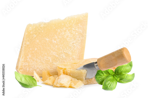 Delicious parmesan cheese and basil on white background