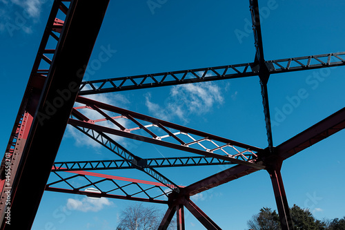 Red bascule bridge over Shadwell basin in a beautiful spring morning. Abstract graphic structure. photo