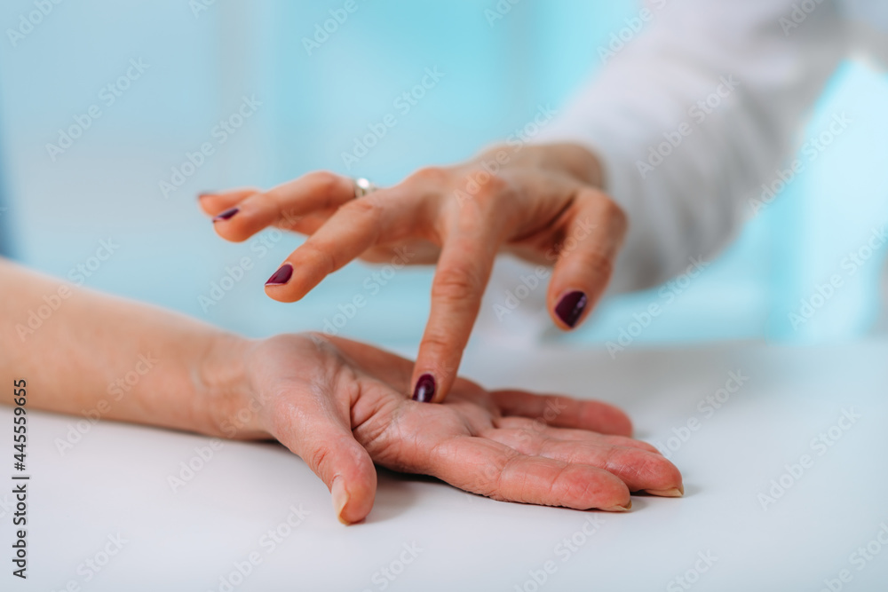 Examining Hand of Senior Patient with Carpal Tunnel Syndrome. Close-up Image of Senior Woman’s Wrist. Examining Hand of Senior Patient with Carpal Tunnel Syndrome. Close-up Image of Senior Woman’s Wrist.
