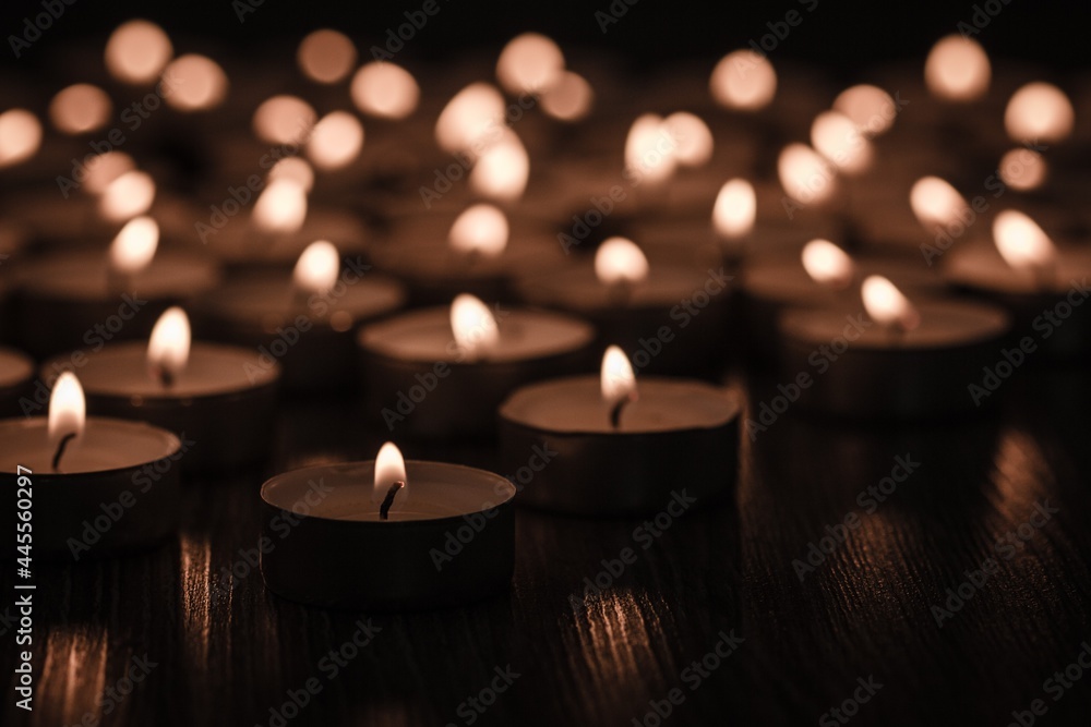 beautiful burning candle, bokeh from burning candles, black and white.