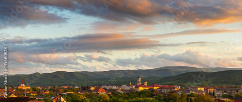 Majestic sunset with colorful clouds above the city of Caransebes