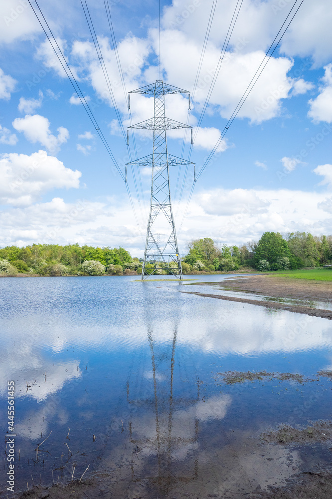 Newburn UK: 24th May 2021: Flooded farmland at Throckley Reef (Reigh) in North England. Flooded field with electricity pylons