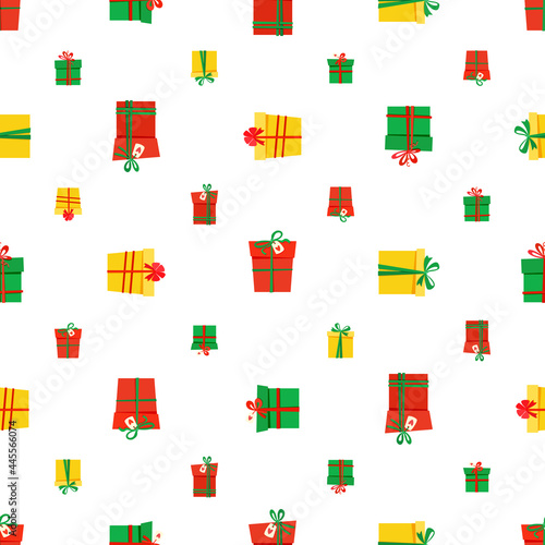 seamless pattern of red, yellow and green gift boxes tied with ribbons. isolated vector images of gift boxes. © Наталья Барматина
