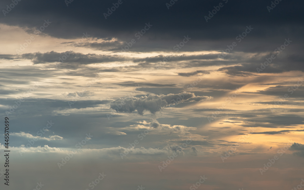 The sun shines through the clouds in the sky. The shape of the clouds evokes imagination and creativity. They can be used as wallpapers that look amazing. Copy space, No focus, specifically. The sun shines through the clouds in the sky. The shape of the clouds evokes imagination and creativity. They can be used as wallpapers that look amazing. Copy space, No focus, specifically.