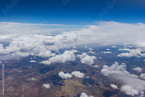 Cloud top aerial view on blue sky beautiful natural landscape from airplane window.
