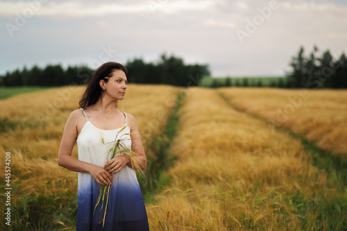 Canvastavla Portrait of young pretty woman without bra in barley field