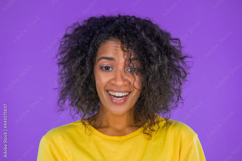 Young mixed race woman is very glad. Concept of surprise, great news, sales, profitable offer. Excited happy lady on purple studio background. Young mixed race woman is very glad. Concept of surprise, great news, sales, profitable offer. Excited happy lady on purple studio background.