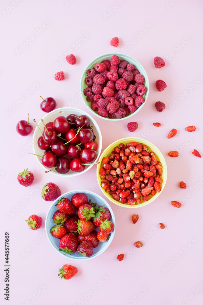 Strawberry,cherry,raspberry berries in bowls Strawberry,cherry,raspberry berries in bowls