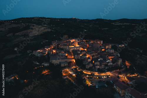 Aerial view of old town of Montemeranoby night, Tuscany, Italy. © francescosgura
