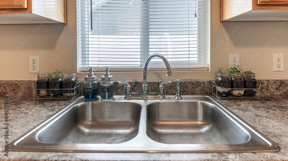 Pano Craftsman style kitchen vanity sink with wood Stock Photo