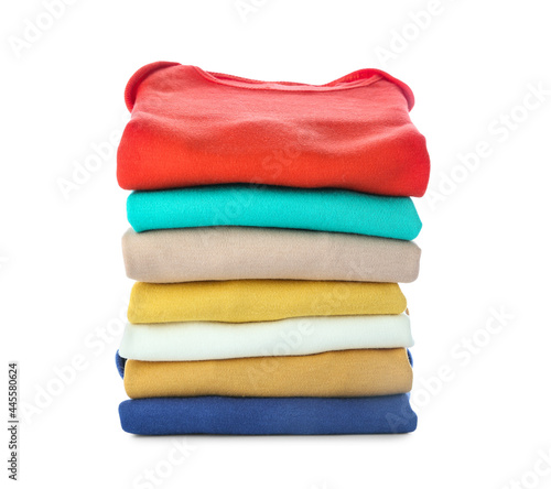 Stack of baby clothes on white background