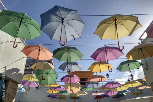 Many umbrellas through the sunlight