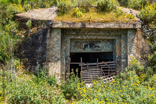 Closeup of one of the countless military concrete bunkers or pillboxes in southern Albania built by communist government of Enver Hoxha. Bunker is turned to the west.
