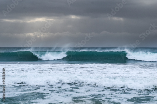 Fototapeta Naklejka Na Ścianę i Meble -  Stormy ocean view with big waves breaking on the Atlantic Ocean in Spain. Winter Atlantic storm with big breaking waves