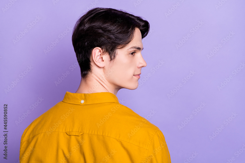 Profile photo of funky brunet young guy look empty space wear brown shirt isolated on violet color background Profile photo of funky brunet young guy look empty space wear brown shirt isolated on violet color background